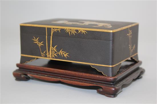 A Japanese gold and silver inlaid iron box and cover, signed Komai, Meiji period, 11cm, rosewood stand